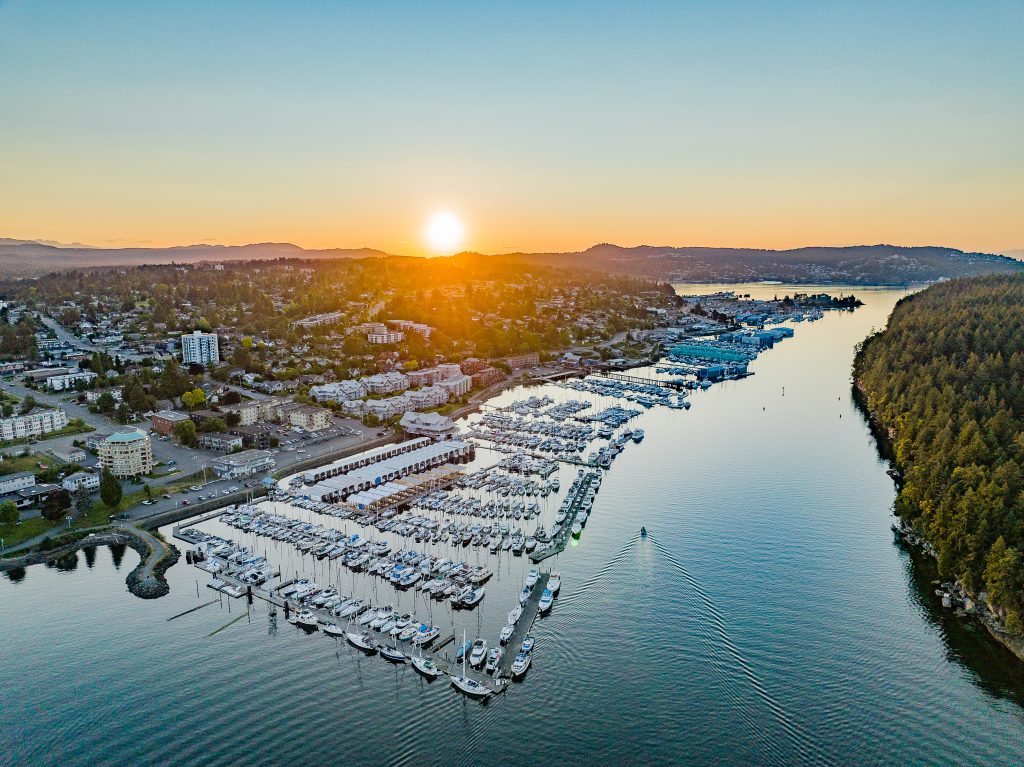 drone image of beautiful sunset over the sea with lots of boats